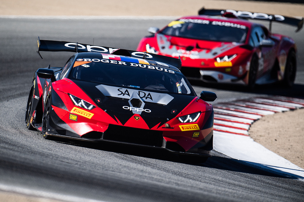 red racecar driving on track